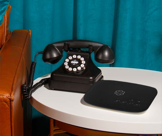 An image of Ooma Telo with Kettle Phone next to it.
